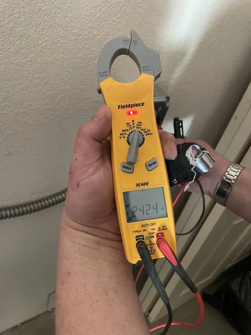 Voltage testing with clamp meter during Circuit Breaker Repair in Pineville